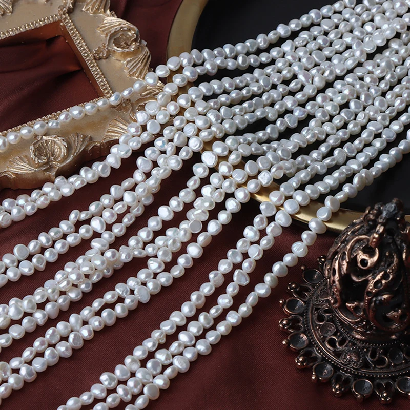A strand of 4mm side-hole small irregular natural freshwater pearls, approximately 36 cm long, containing about 80 beads.