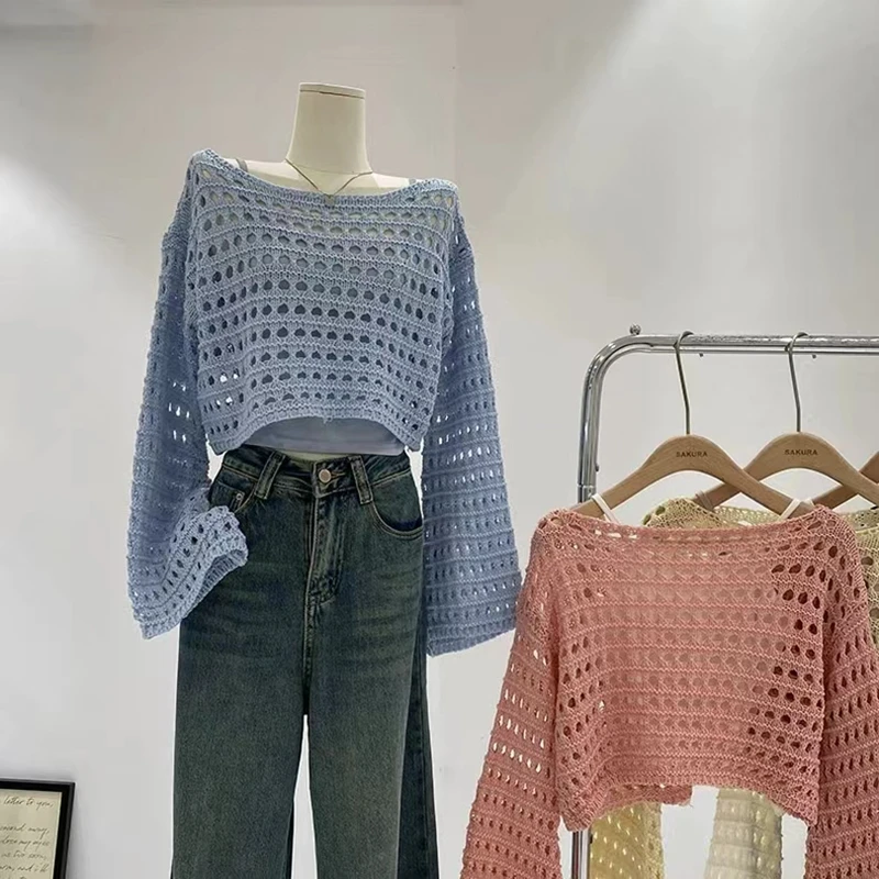 

Spring and summer new French short long-sleeved hollow knitted sweater women's design sense thin sunscreen blouse top