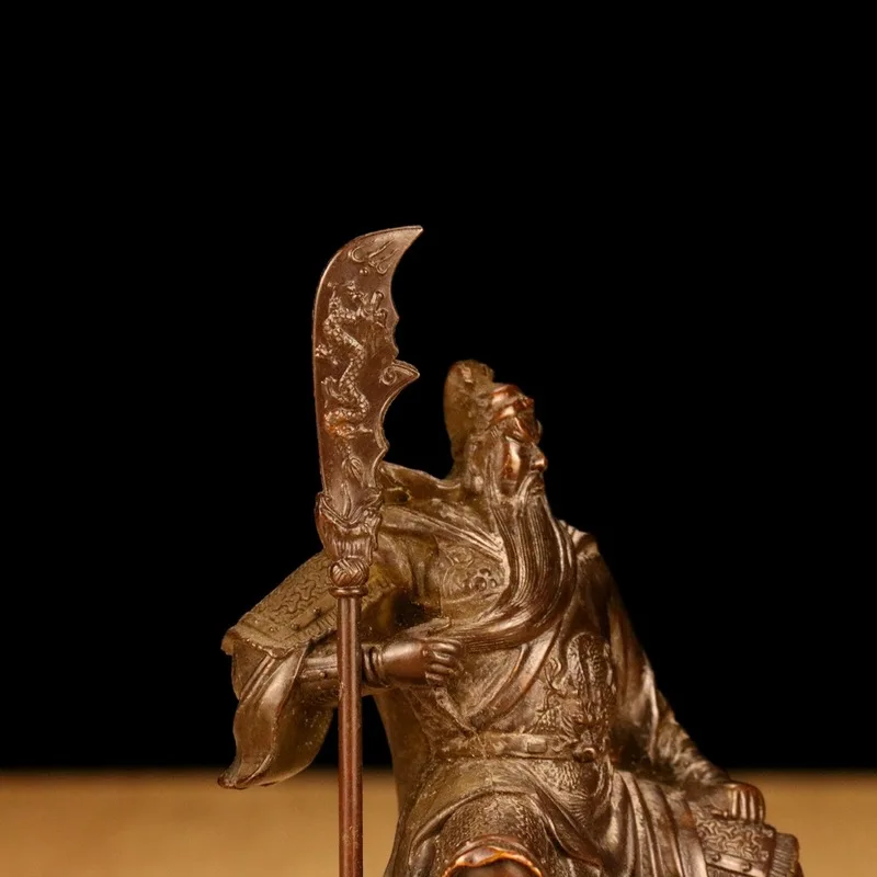 Vintage bronze Guan Gong figurine, depicting Guan Yu sitting with a large saber, a decorative alloy craft for home use