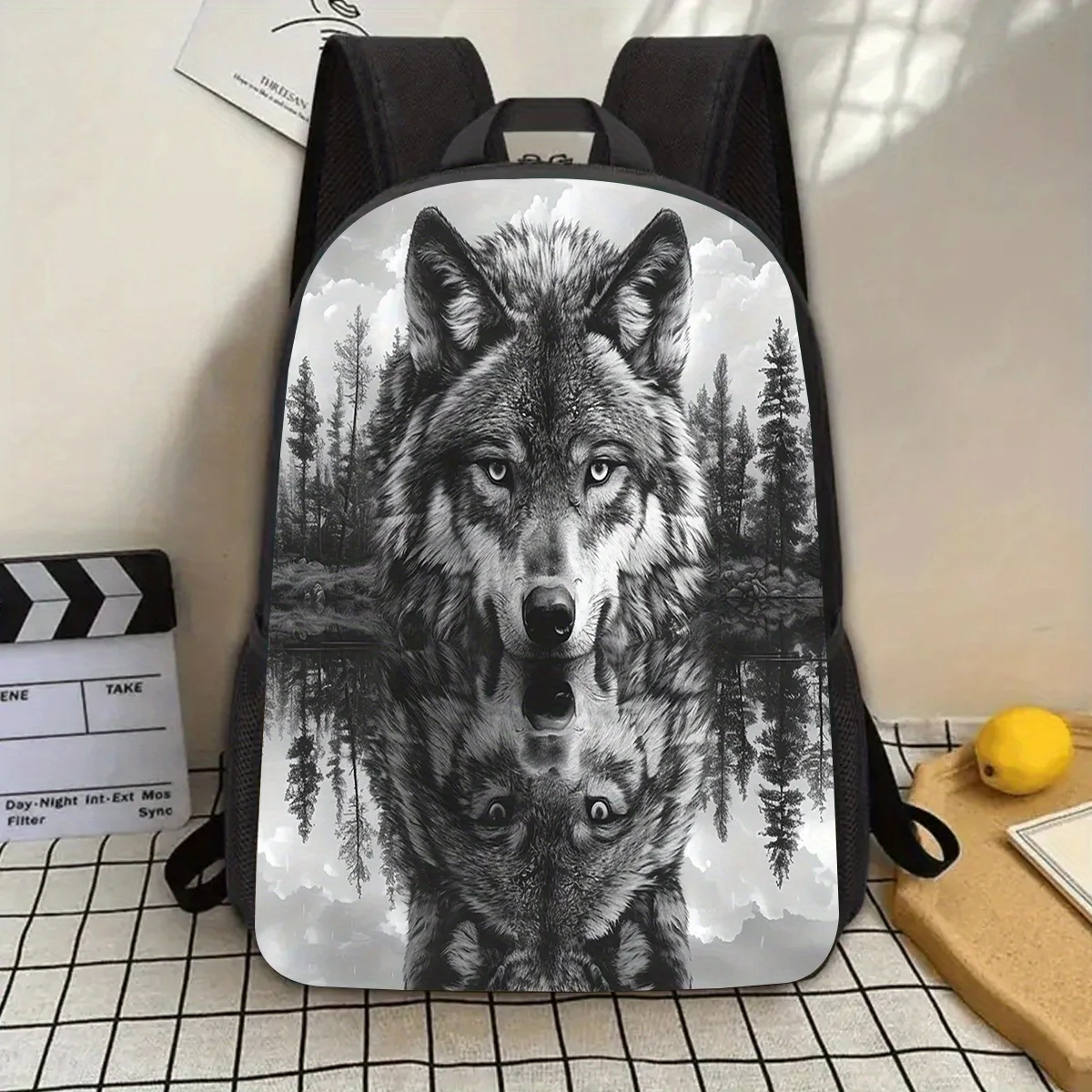 

A 17-inch laptop backpack with a black and white Wolf pattern and a water bottle case is lightweight and durable