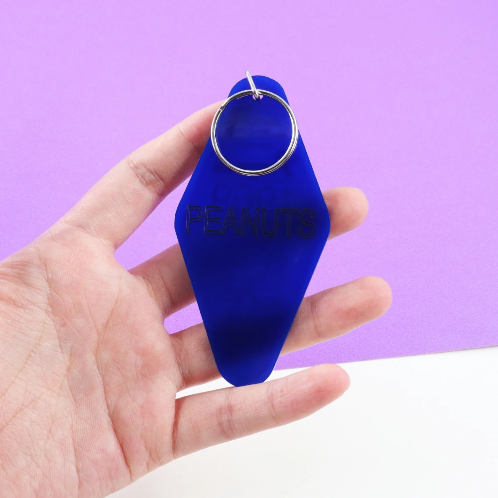 رائد الفضاء العالمي الشهير 1969 النسخة الأمريكية الرجعية موتيل المفاتيح الديكور كلاين الأزرق لطيف الكرتون مفتاح قلادة عصابة