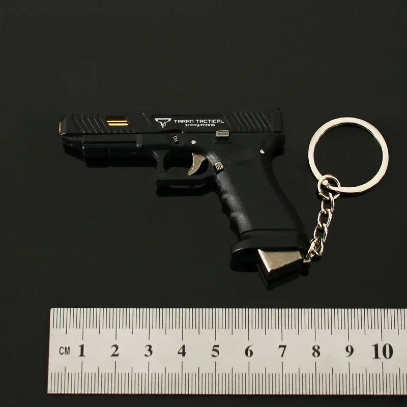 1PC 1:3 Mini Gun Pendant Nylon Hand Grab Half Alloy TTI G34 Pistol Model Metal Keychain