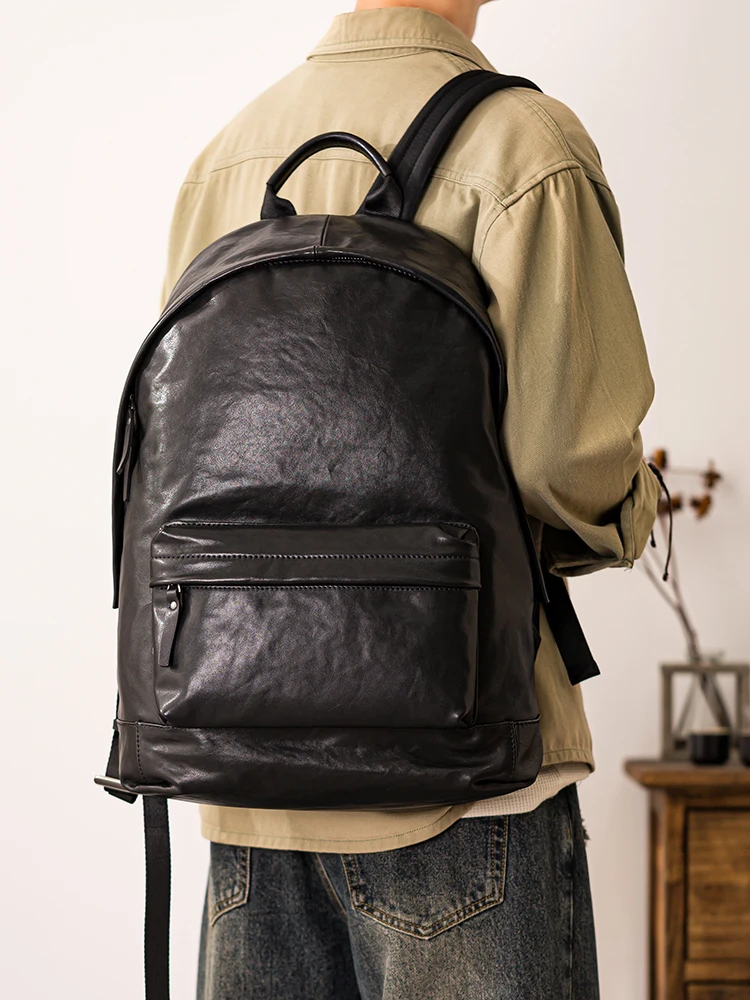 PNDME simple casual luxury genuine leather men's large capacity backpacks outdoor travel designer cow leather laptop black bag