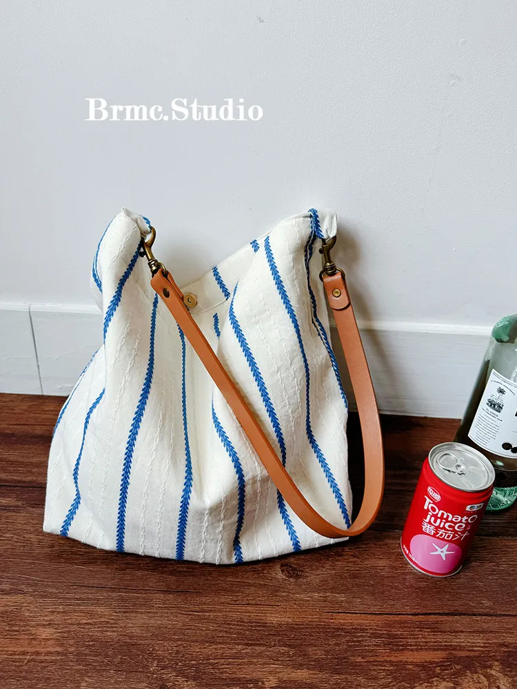 

Blue and white striped canvas bag women's large capacity tote bag commuter shoulder bag shoulder bag beach bag tote bag
