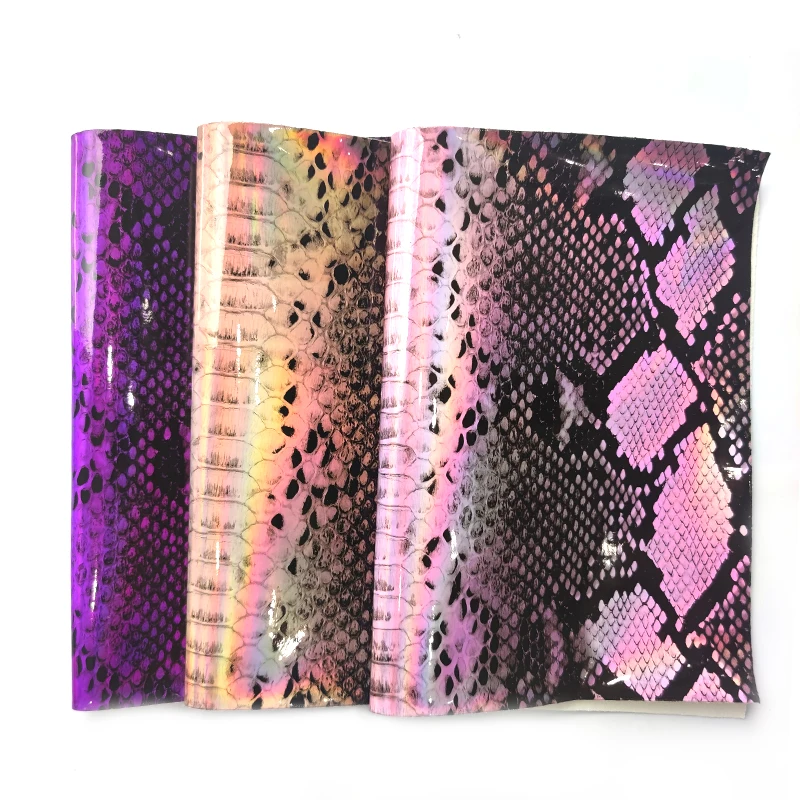 

Snake Skin Printed Holographic Mirror Laser Reflective PU Faux Leather Fabric Sheet for Making Handbag DIY Accessories 46x135cm