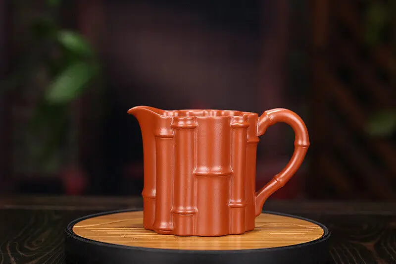 

Китай Исин Цзыша керамика клевер кустарник глина ручной работы 300cc бамбуковый шарнирный чайник