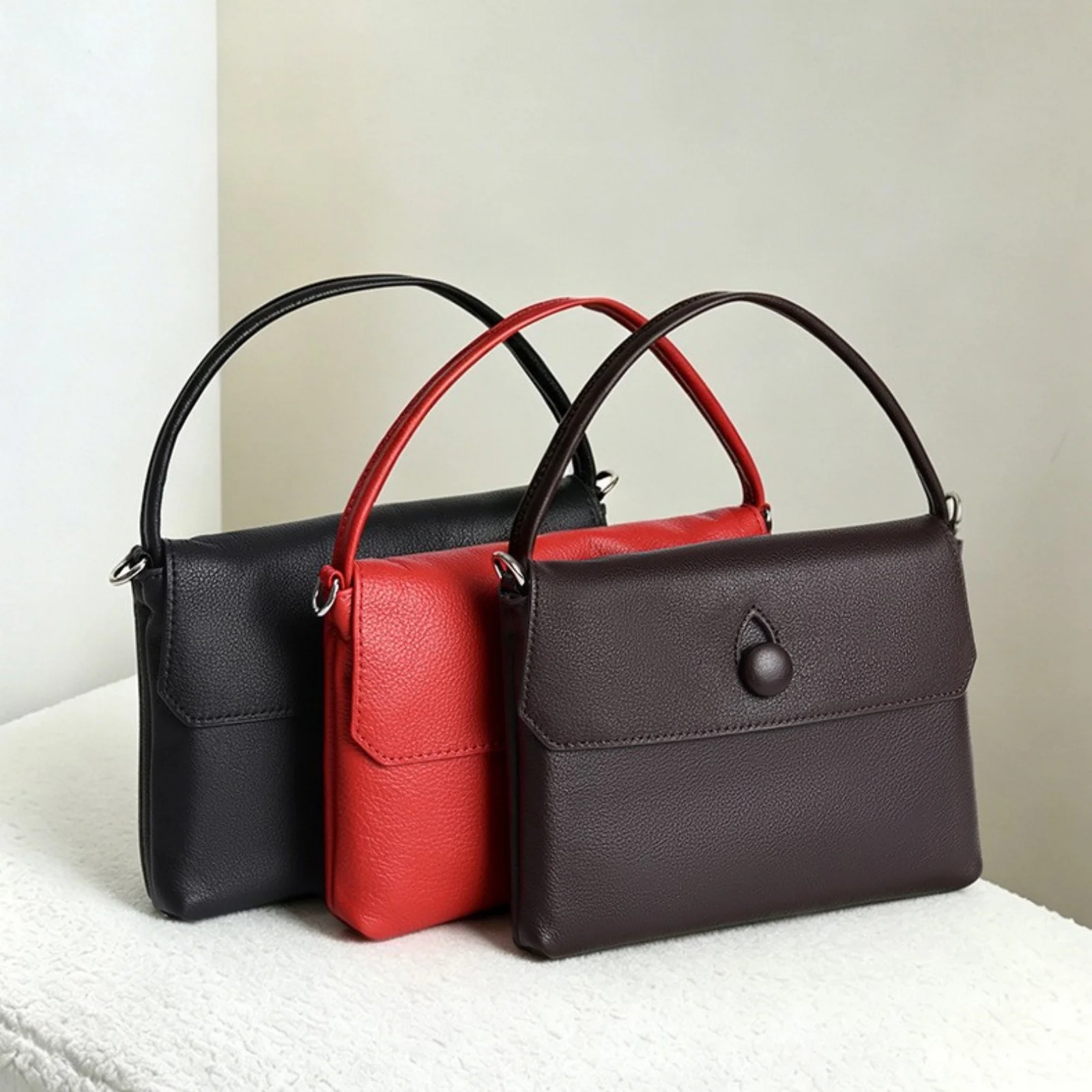 2026 New Women Flap Handbag with Leather Wrapped Button Closure Single Flat Top Handle Soft Leather Exquisite Craft Shoulder Bag