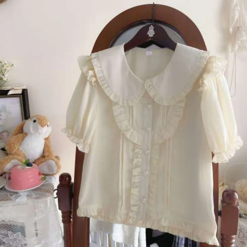 Blusa Lolita de manga curta feminina, camisa elegante de rosto de boneca, roupa versátil, doce fresca, respirável e confortável, nova para primavera e verão