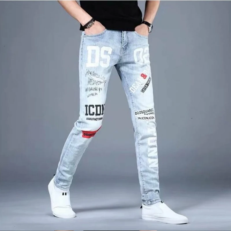 Moda Koreańskie Dżinsy Męskie Graffiti Nadrukowane Litery Spodnie Dżinsowe Męskie Streetwear Slim Fit Niebieskie Dżinsy Hip hop Małe Spodnie Stóp