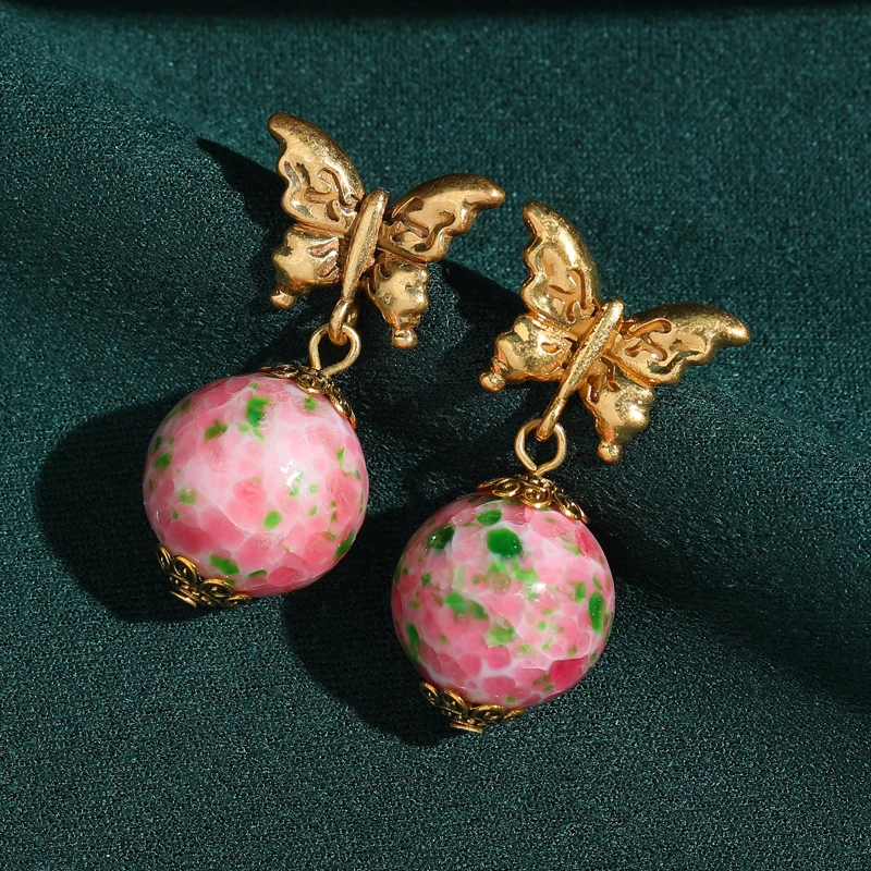 

Antique Gold Plated Butterfly Pink Earrings Pendant Frog Skin Glass Beads Jewelry Luxury Female 2026 New Music Festival Art Deco