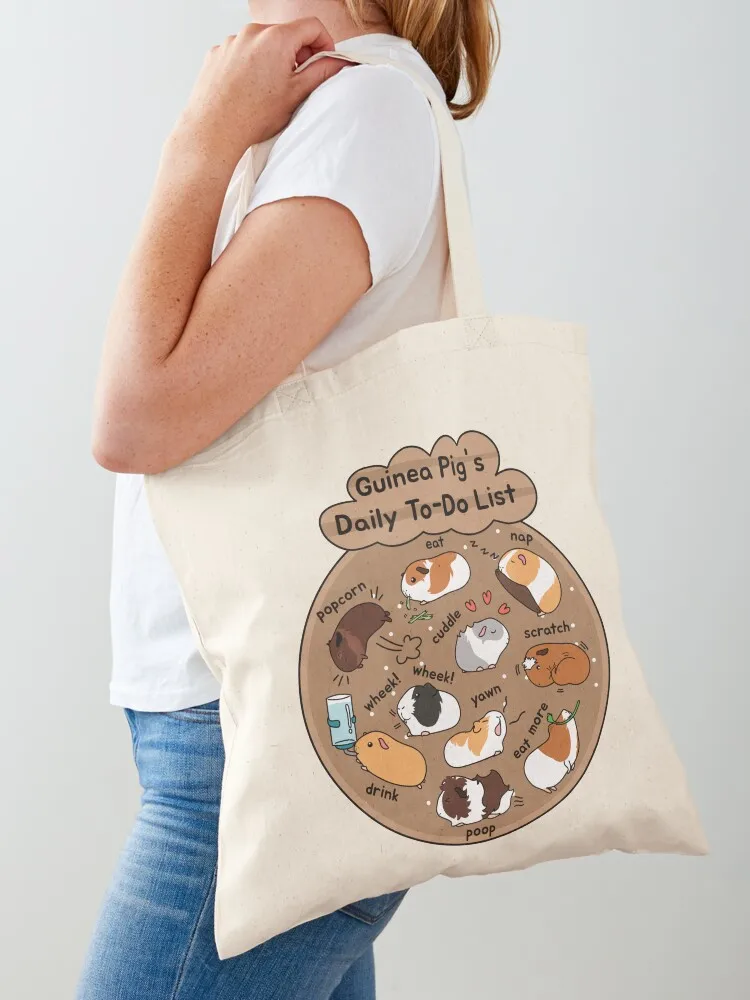 

Сумка-шоппер с коричневым фоном и надписью «Ежедневный список дел для морских свинок» — женская многоразовая холщовая сумка для покупок.