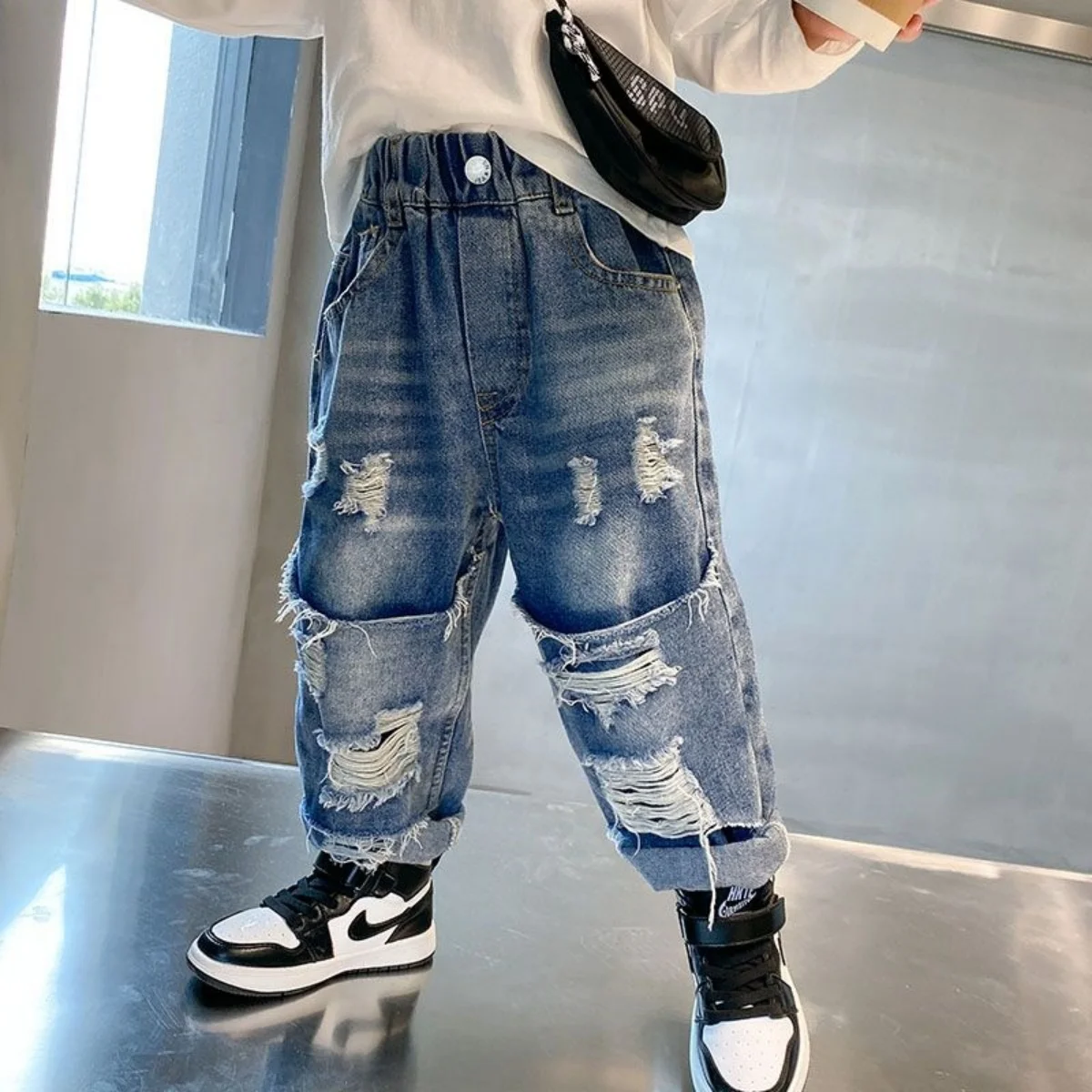 

2025 Children's Spring and Autumn New Jeans for Boys and Girls with Ripped Holes Soft and Comfortable Pants for Children Trendy