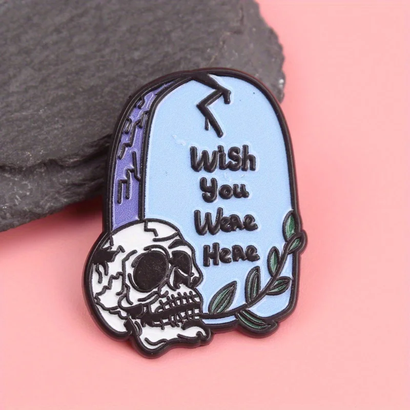 Morbid Greetings Enamel Pin - 'WISH YOU WERE HERE' Tombstone with Cracked Skull & Verdant Accents, Dark Humor Jewelry for Cemete