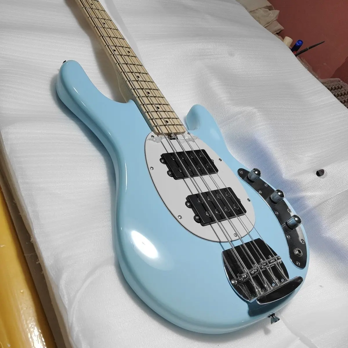 Fresh sky blue 4-series electric bass, very high-end and classy, professional bass player