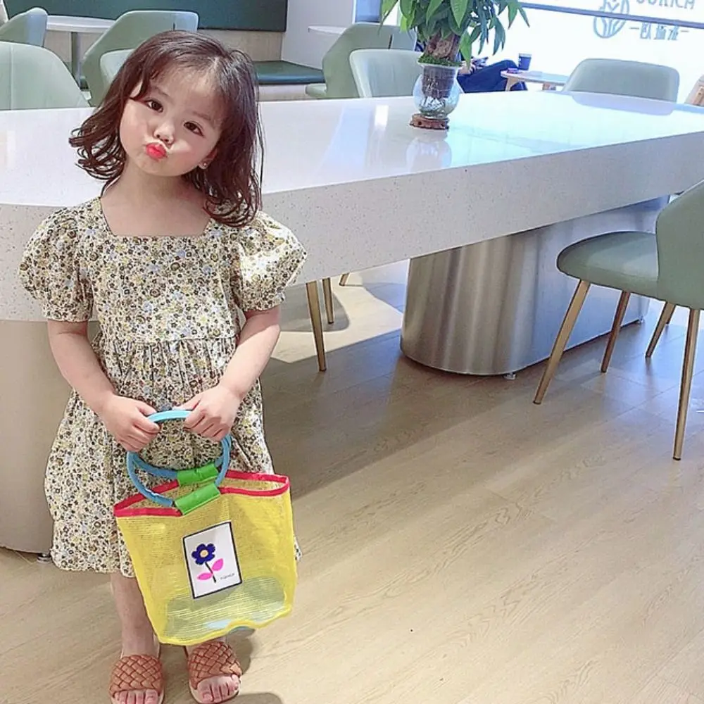 اللون الاصطدام شبكة حمل حقيبة شفافة قذيفة حقيبة التخزين الأطفال حقيبة يد الجوف خارج الأم الاطفال حقيبة شبكة حقيبة شاطئية السفر