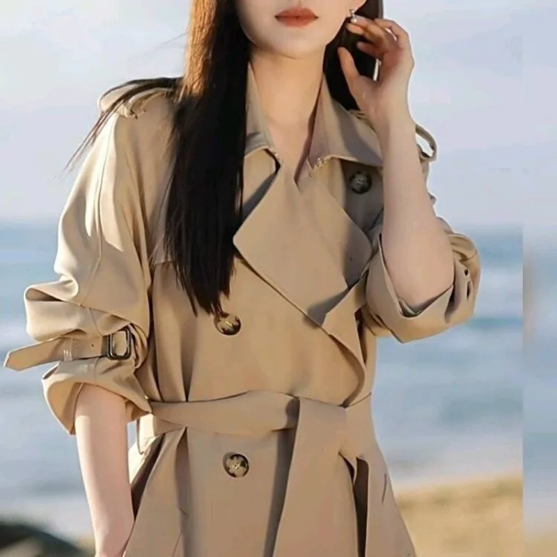 2025 feminino outono e inverno novo emendado gola meio aberta botão bolso moda solta jaqueta corta-vento de comprimento médio