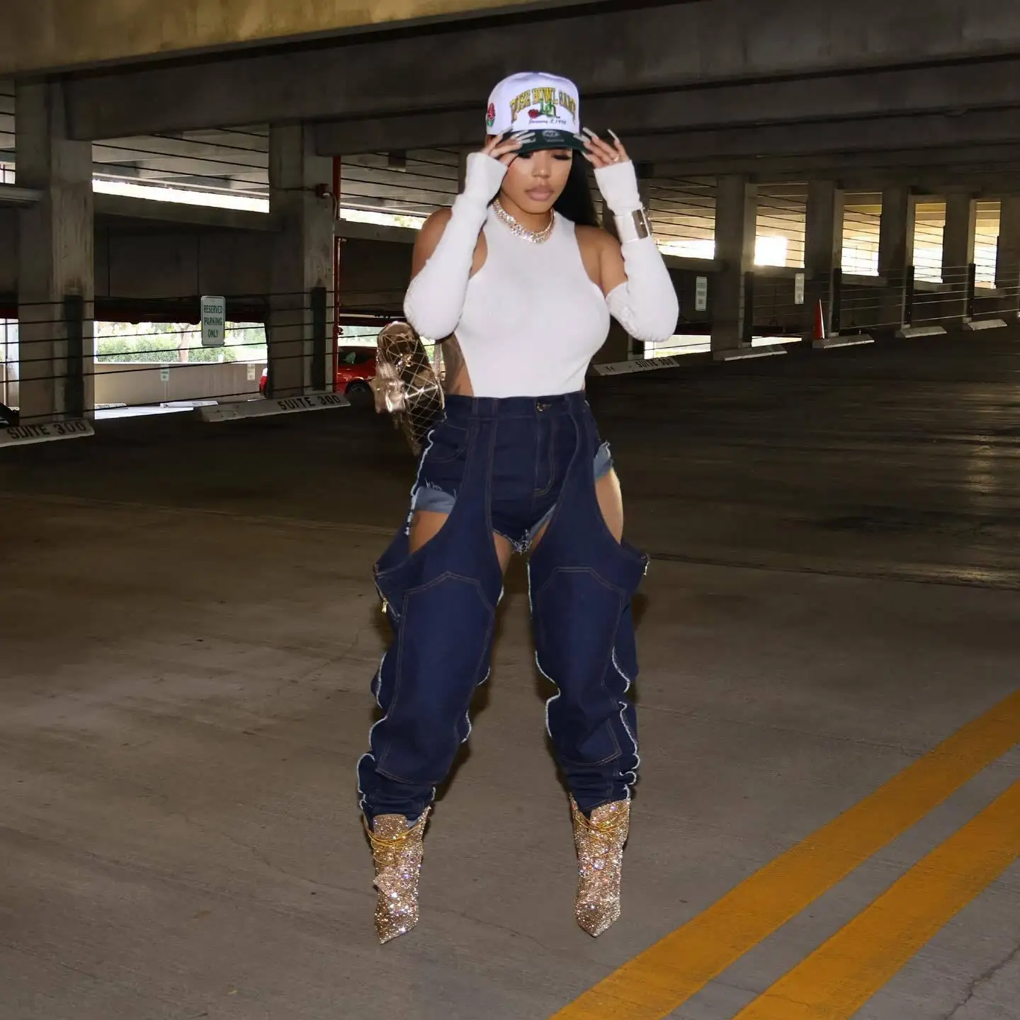 

European and American fashion women's clothing, irregular hollow splicing elastic jeans ripped jeans for women cargo pants women