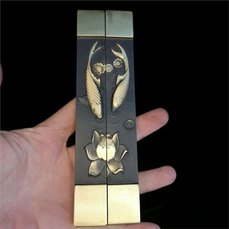Stationery items: Brass paperweight with embossed small town design, priced per pair