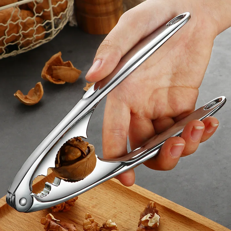 الصنوبر البقان البندق ذو طيات متعددة الوظائف سريعة الجوز المفرقع المقشر فتاحة الفولاذ المقاوم للصدأ كسارة البندق الجوز المفرقع