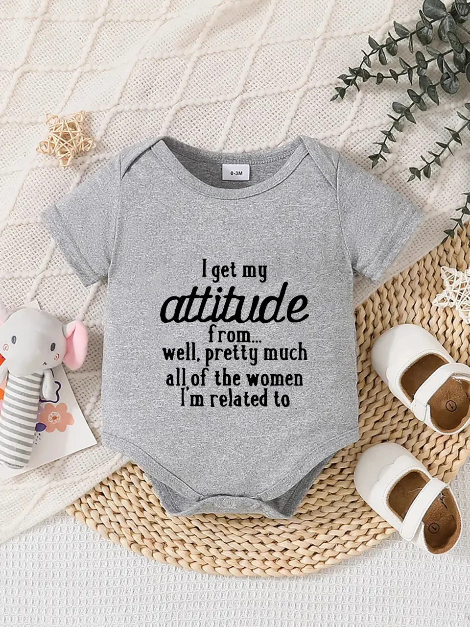 Playful letter-printed baby short-sleeve triangle bodysuit. Button closure for easy dressing, machine washable