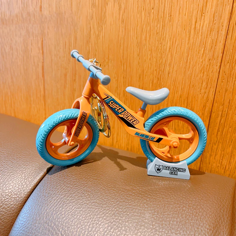 Cartoon Creative Fun mobile Can Glide Bicycle coppia gioielli portachiavi ciondolo decorazioni Desktop regalo di compleanno per bambini