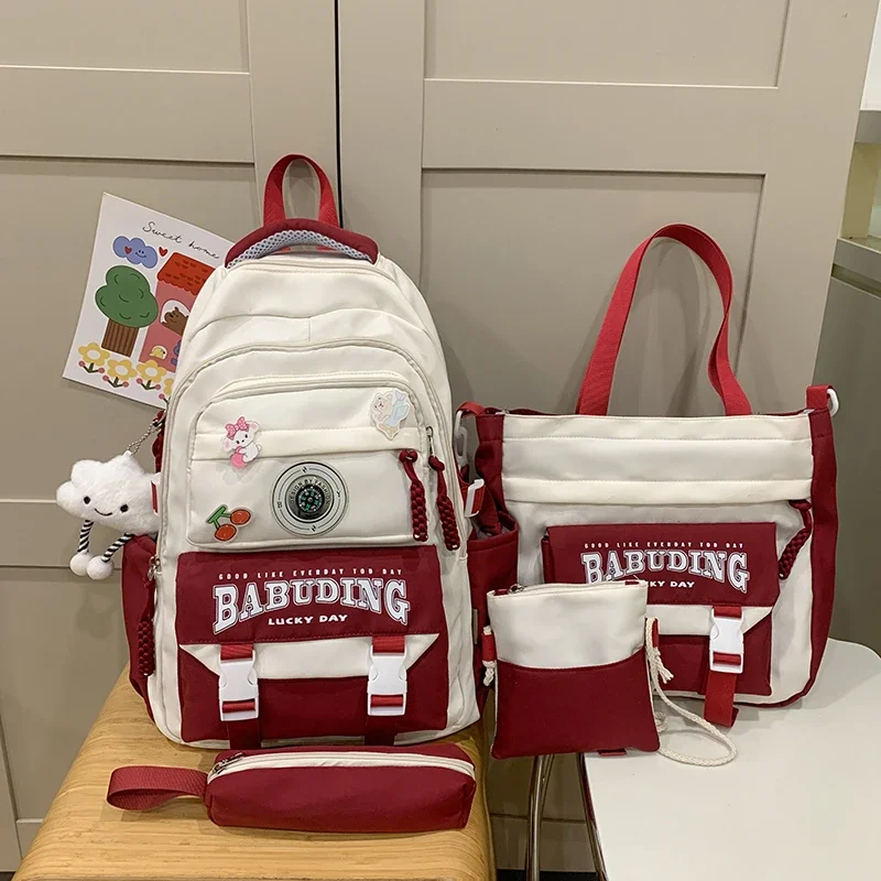 2025 Set di borse da scuola con manico morbido in nylon per la stagione del ritorno a scuola di alta qualità, combinazione di zaini casual con struttura esterna con cerniera solida