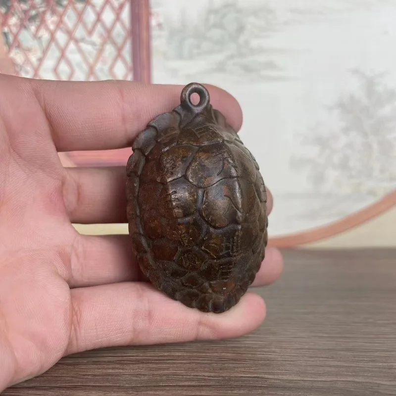 Copper , symbolizing wealth and prosperity, turtle shell pendant, a cultural artifact for men to carry with them