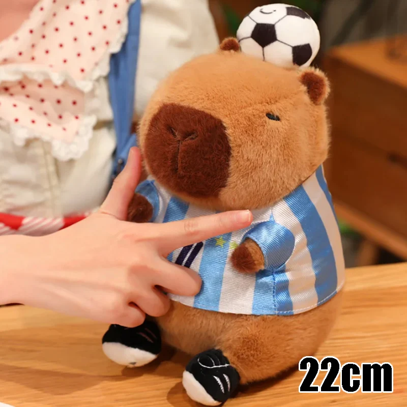 

Soccer Playing Capybara Plush Toy Adorable Stuffed Animal Doll for School Sports Day Prizes Cute Cuddly Reward for Kids