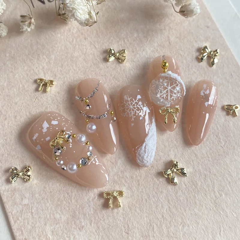 10 ピース/ロットかわいいゴールドシルバー弓ネイルチャーム合金日本ちょう結びリボン金属アクセサリーネイルアートの装飾