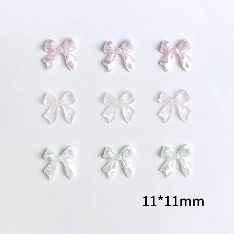 ピンクの氷のように透明なリボンボウネイルアートアクセサリー、光沢のあるボウコンテ樹脂ネイルチャーム、DIYマニキュアデザインネイルデコレーションパーツ