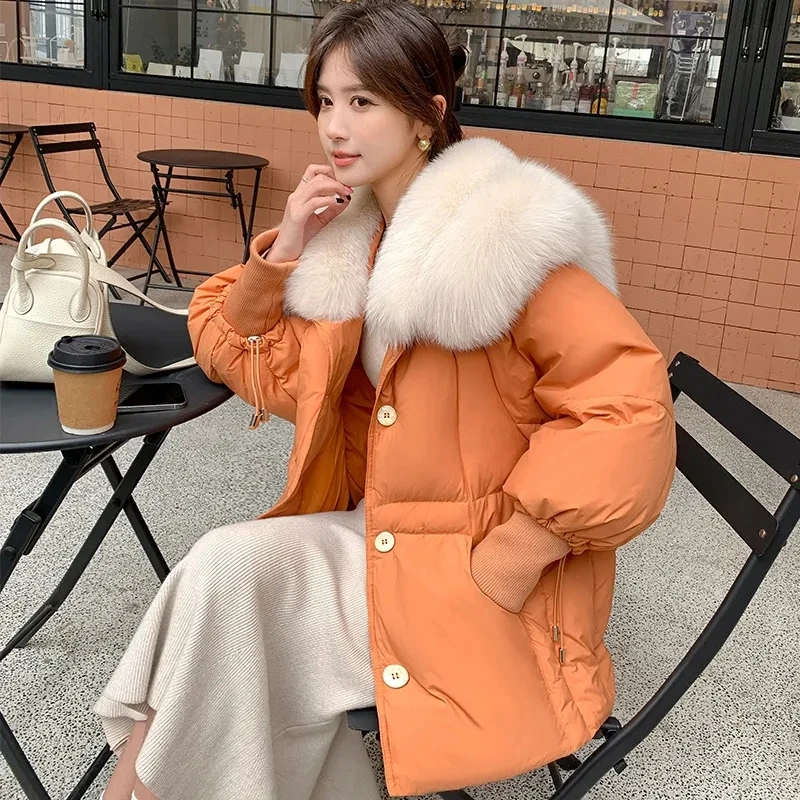 2025 Moda donna elegante pelliccia di volpe artificiale piuma d'anatra bianca nero arancione piumino, cappotti lunghi caldi da donna