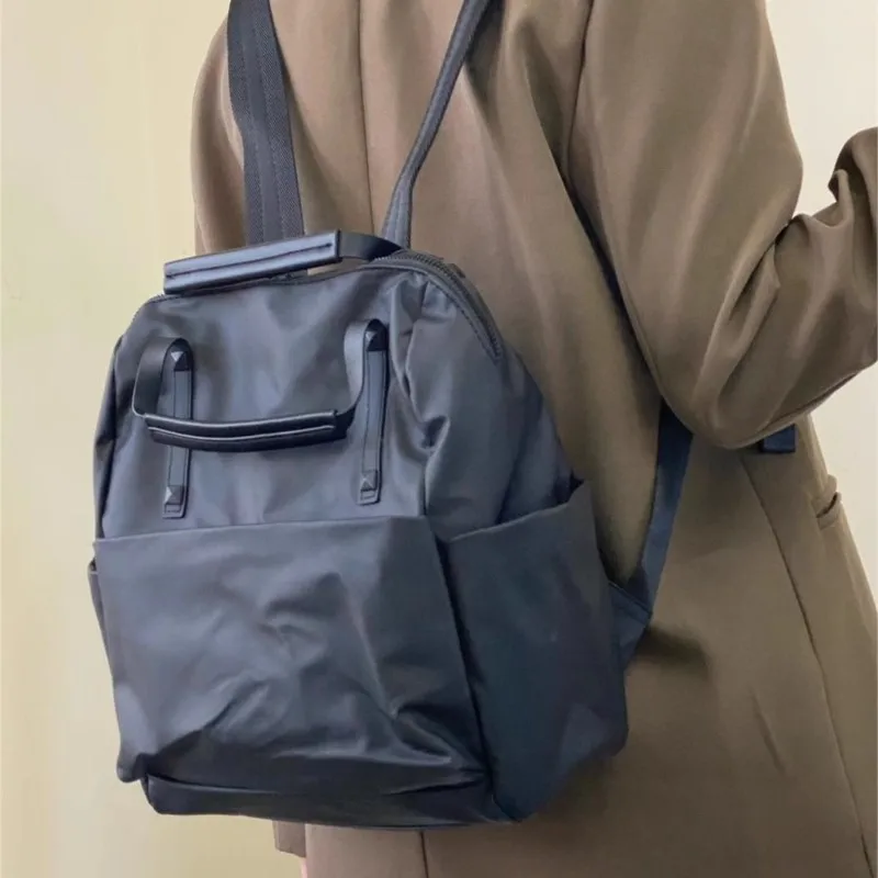 حقيبة ظهر JIAERDI من النايلون الأسود للنساء مقاومة للماء وخفيفة الوزن وسعة كبيرة حقيبة يد عصرية متعددة الاستخدامات للتنقل اليومي #2