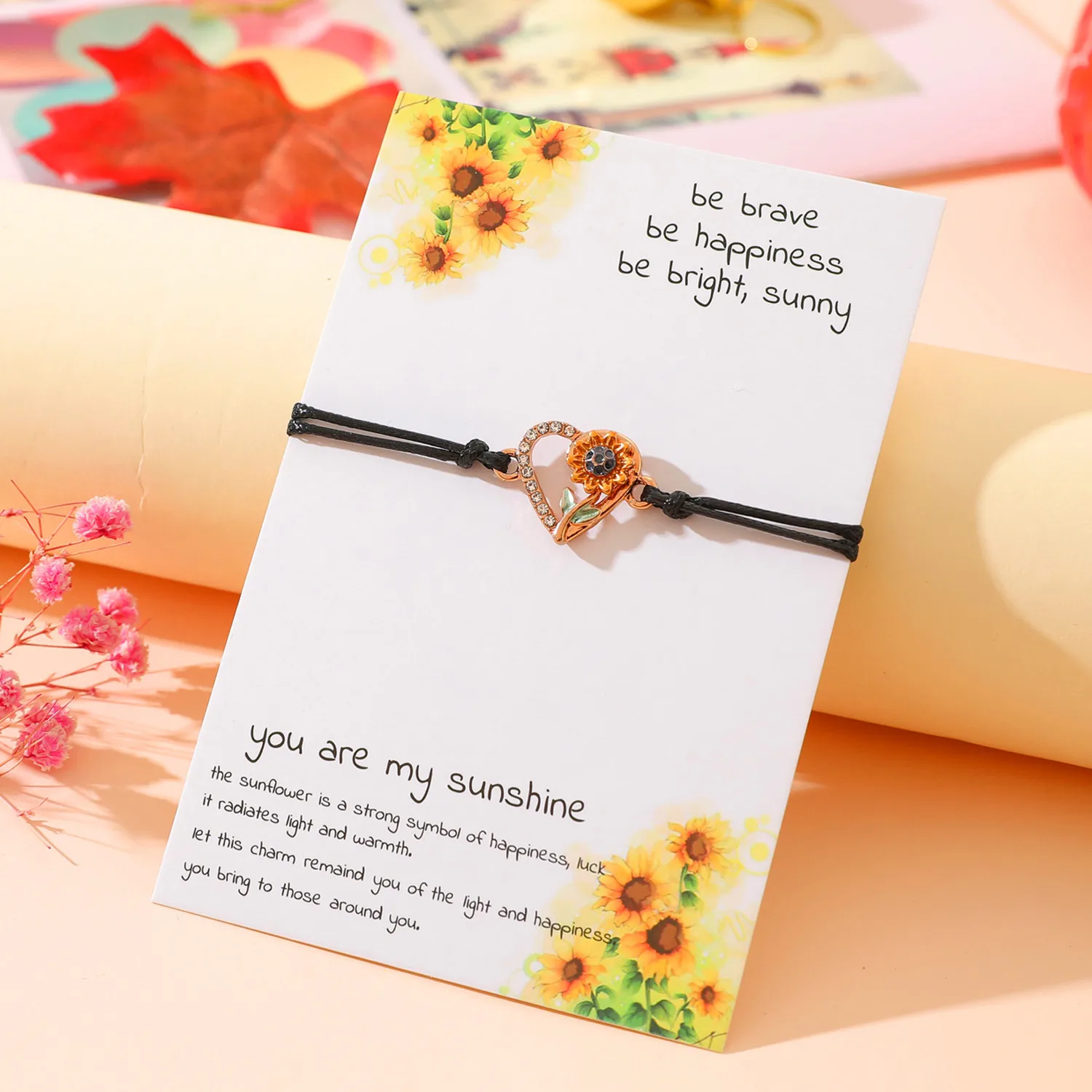 Wholesale of New Heart shaped Sunflower Bracelet Metal Dropping Oil Hand Knitted Handrope Card Handicrafts Gift
