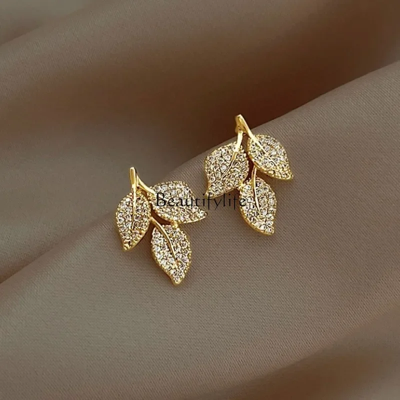 Japanese and Korean micro-inlaid zircon plated real gold color-retaining leaf earrings, atmospheric high-end sense