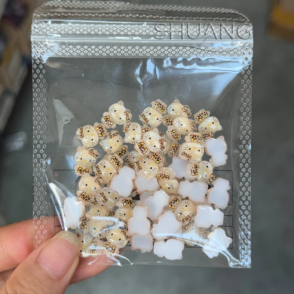 

50Pcs Glitter Leopard Print Hello Kitty Nail Charms 3D Cute Cartoon Melody Kuromi Leopard Print Nail Decor Resin Y2k Nail Access