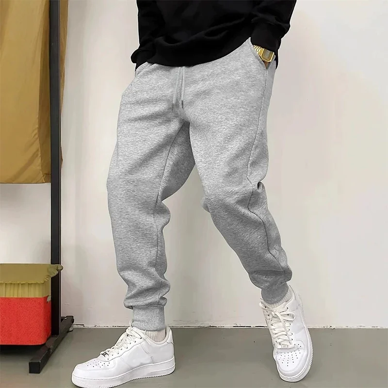 Basic‑styled solid plain fabric artwork print relaxed loose sweatpants men hip hop sports casual jogger pants modern cut