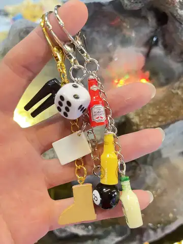 The multi - element keychain squad makes the bag come with a fun filter.