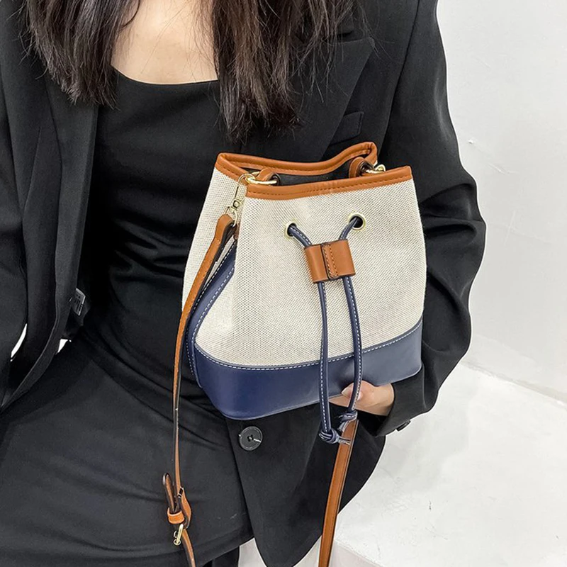 New canvas contrast color portable bucket bag Street trend texture drawstring One Shoulder Messenger canvas bag