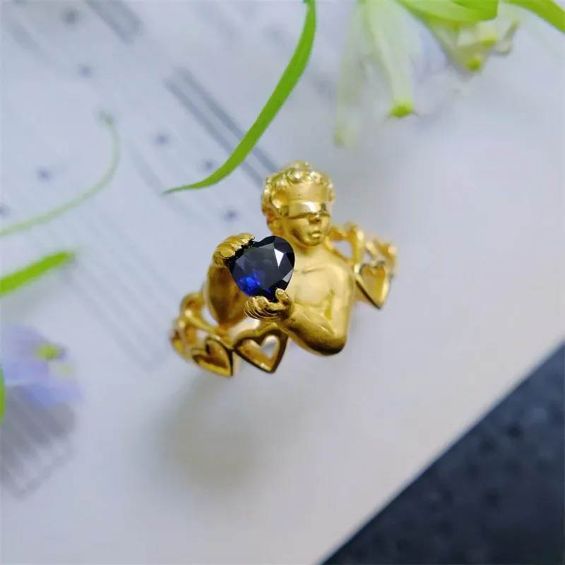 French Luxury Style Gold Color Metal Ribbon Blindfolded Little Angel Blue Heart-shaped Zircon Ring UNISEX High End Banquet Rings