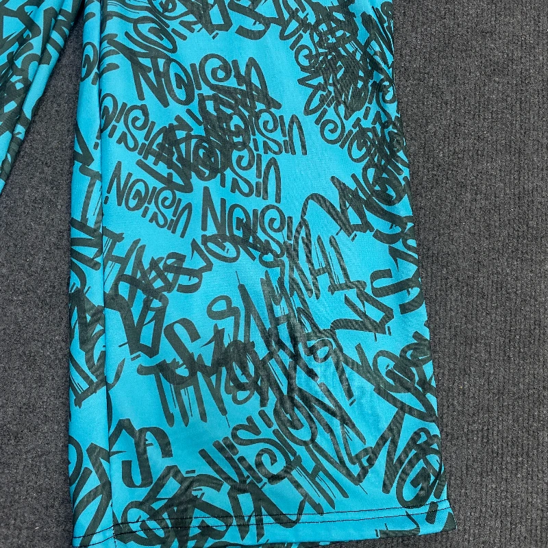 Los Pantalones anchos de doble cintura están de moda, vanguardistas, superpersonalizados y falsos de dos piezas con patrón fluorescente