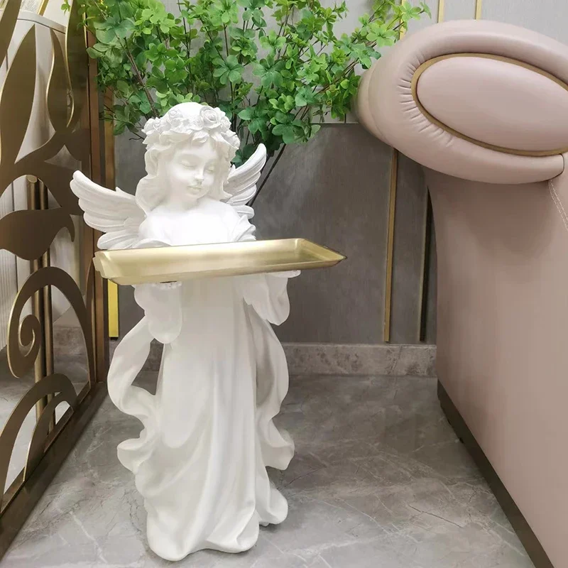 The little angel on the tray, a large floor standing statue