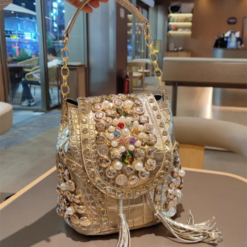 

Spring new PU large-capacity pearl rhinestone rivet cross-body backpack casual tassel chain one-shoulder underarm women's bag