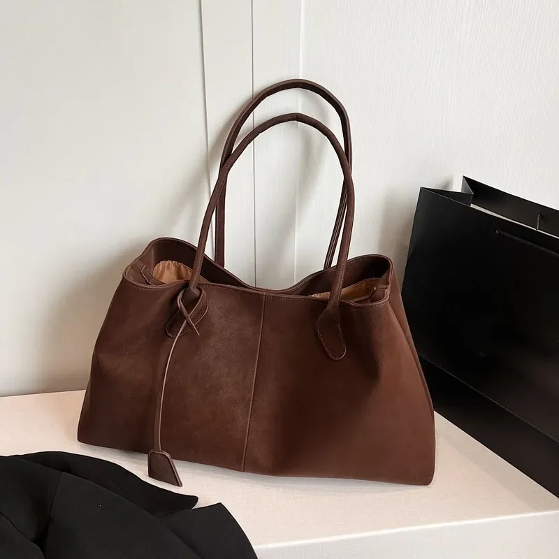 Borsa versatile alla moda di alta qualità in tinta unita in finta pelle scamosciata 2026 Borsa a tracolla di grande capacità di vendita calda del prodotto da donna