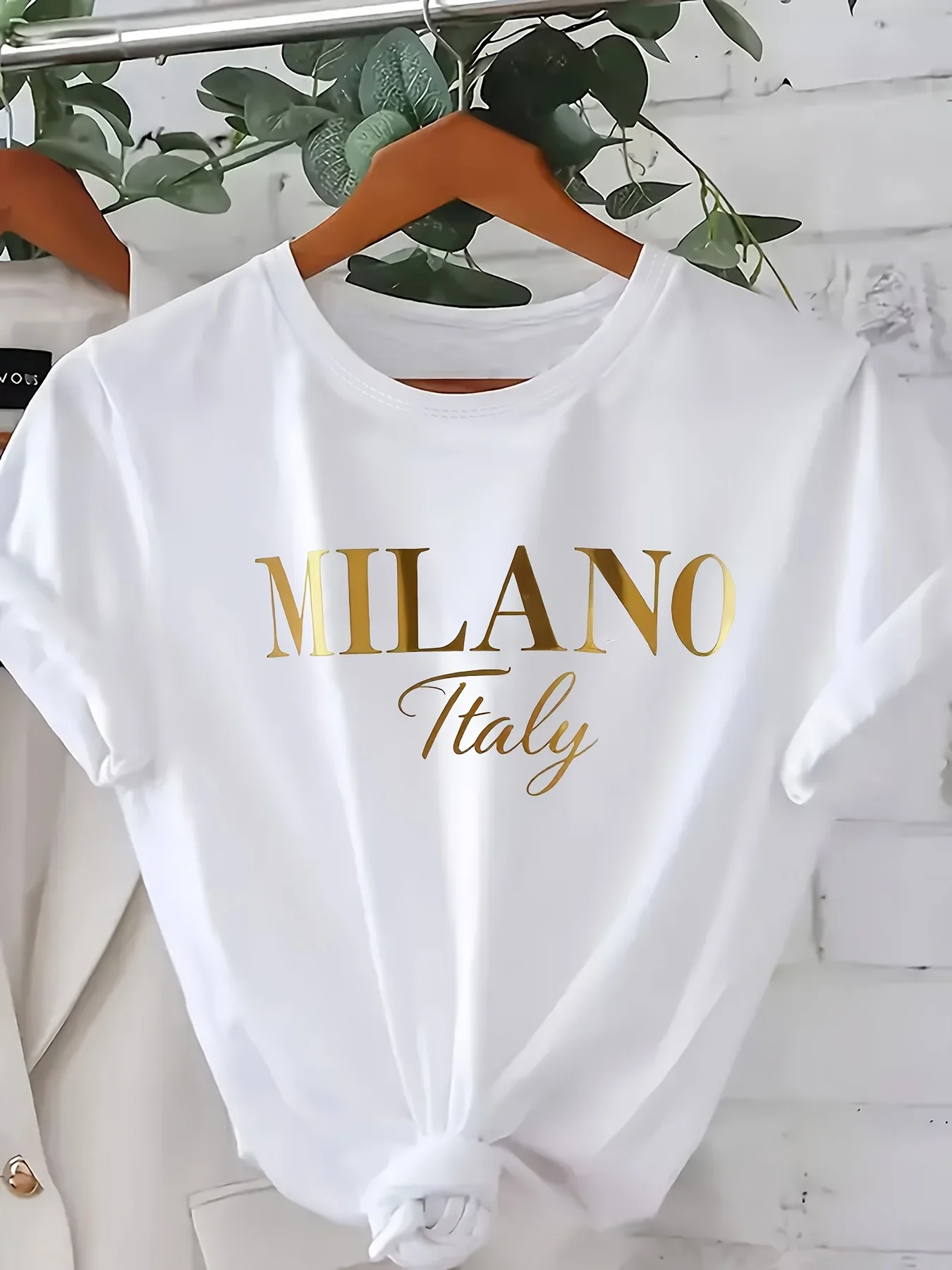This Women Fashion Short Sleeve Top Features an Elegant Design with a Golden Uppercase MILANO Print Embodying a Minimalist Style