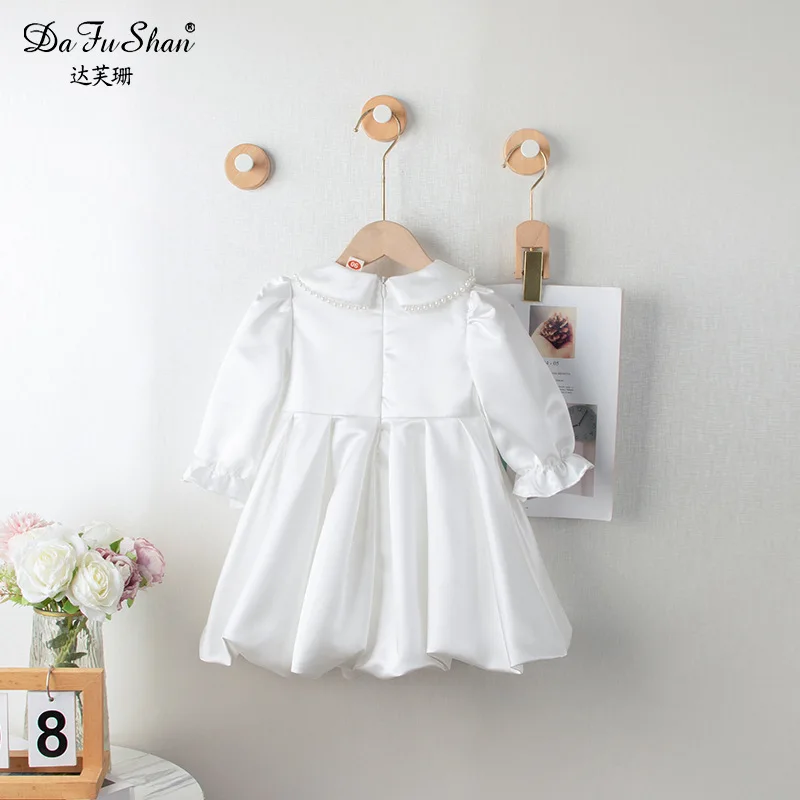 فستان موري أبيض للربيع والخريف للفتيات على الطراز الكوري ملابس أطفال أوائل الخريف بأكمام طويلة جديد مطوي من الدانتيل L