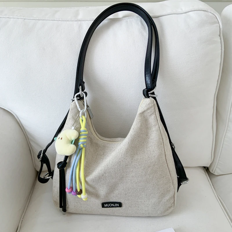 

Korean Casual Canvas Backpacks Women simple Lightweight Travel Backpack with Pendant Student Commuter Tote Bag