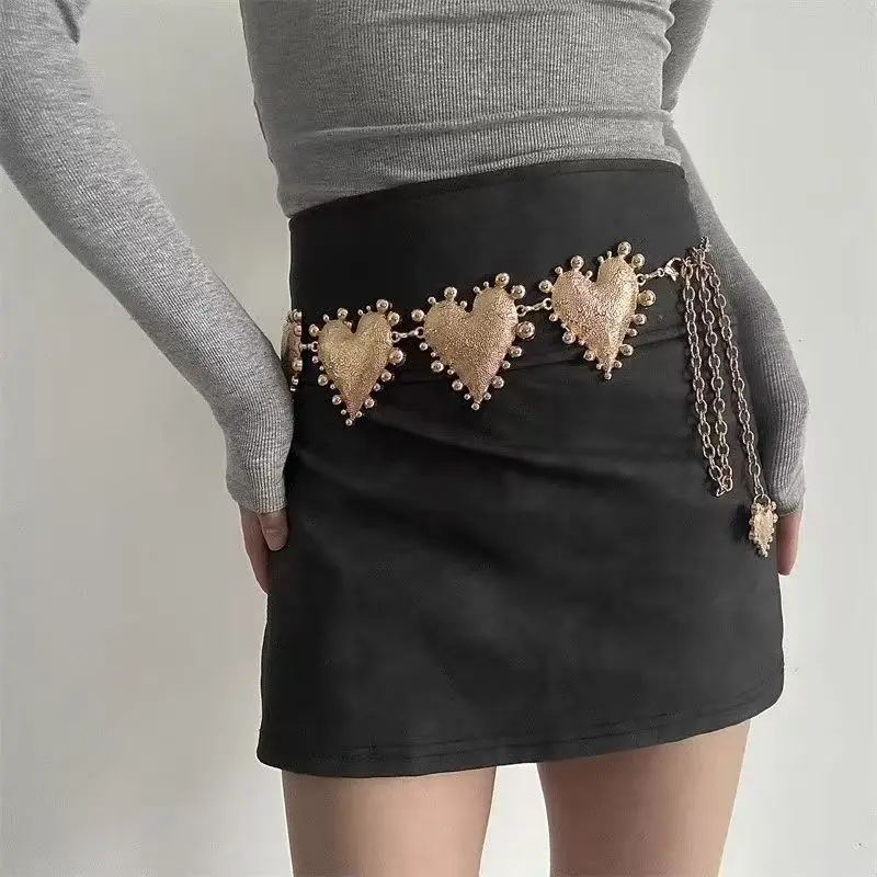 A high-end women's waist chain — a bold metal belt featuring an oversized heart design, adding a unique and stylish touch