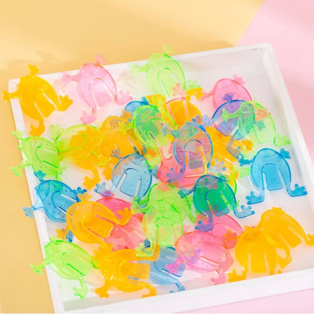 Regalo in plastica che salta rana colore casuale trasparente/colore solido giocattoli divertenti che rimbalzano giocattoli rana