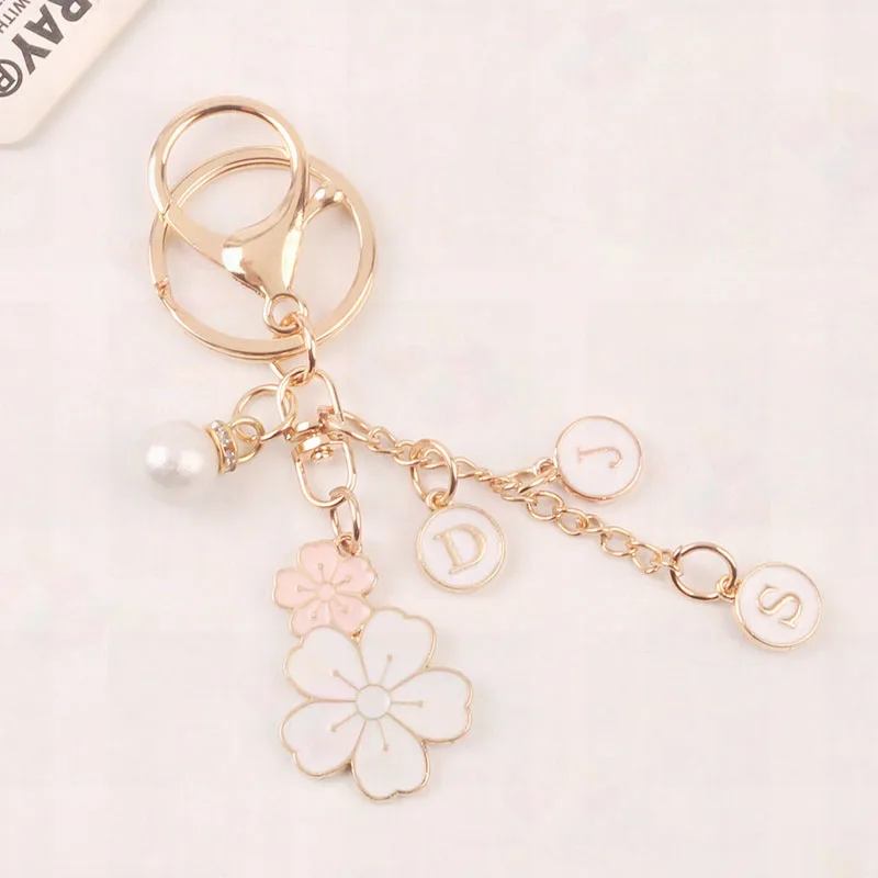 Creative Twin Flower Keychain Cute White Flower Letter Pearl Key Ring Love Key Ring Headphone Cover Bag Hanging Decoration Gift