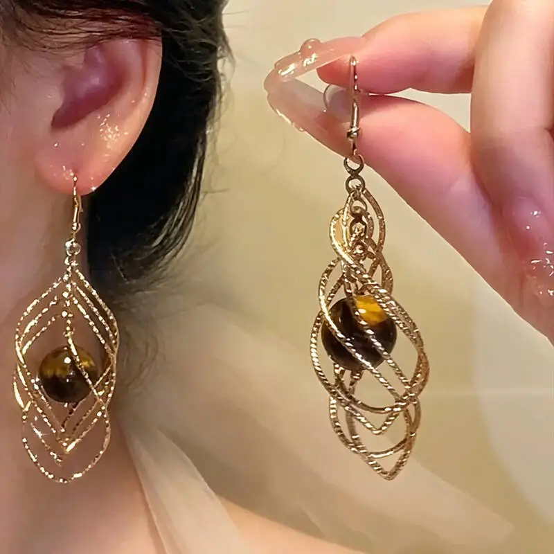 New Autumn Winter Metal Resin Twisted Teardrop Pendant Earrings Featuring A Unique Design That Makes The Face Appear Smaller
